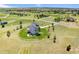 Lovely backyard with white fencing, patio, and ample green space perfect for outdoor enjoyment at 3047 Deer Creek Ranch Loop, Parker, CO 80138