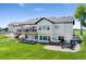 Expansive backyard with a deck, patio, hot tub, and fire pit, offering plenty of space for outdoor activities at 3047 Deer Creek Ranch Loop, Parker, CO 80138