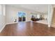 Finished basement with wood-look tile, walk-out access to the hot tub, and staircase at 3047 Deer Creek Ranch Loop, Parker, CO 80138