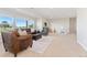 Finished basement with large windows providing natural light and a cozy seating area at 3047 Deer Creek Ranch Loop, Parker, CO 80138