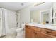 Traditional bathroom with tile floors, tub, and vanity at 3047 Deer Creek Ranch Loop, Parker, CO 80138