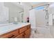 Bathroom features a tub with shower and curtain plus a vanity at 3047 Deer Creek Ranch Loop, Parker, CO 80138