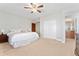 Spacious bedroom featuring plush carpet, walk-in closet, and ensuite bathroom with double sinks and vanity at 3047 Deer Creek Ranch Loop, Parker, CO 80138