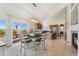 Bright dining area with modern lighting and views of the backyard deck, blending indoor/outdoor living at 3047 Deer Creek Ranch Loop, Parker, CO 80138