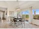 Charming dining area featuring a modern chandelier and a large sliding glass door to the outdoor deck at 3047 Deer Creek Ranch Loop, Parker, CO 80138