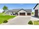 Charming single-story home with stone accents, a well-manicured lawn, and a spacious three-car garage at 3047 Deer Creek Ranch Loop, Parker, CO 80138