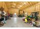 Spacious garage featuring vehicle lift and ample workspace at 3047 Deer Creek Ranch Loop, Parker, CO 80138