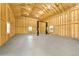 Spacious garage with an auto lift, windows, and wooden frame construction, perfect for car enthusiasts or a workshop at 3047 Deer Creek Ranch Loop, Parker, CO 80138