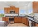 Well-lit kitchen featuring stainless steel appliances, granite countertops, and a picturesque view at 3047 Deer Creek Ranch Loop, Parker, CO 80138