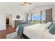 Bright main bedroom featuring high ceilings, view of the golf course, and ensuite access at 3047 Deer Creek Ranch Loop, Parker, CO 80138