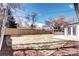 Spacious backyard featuring a new wooden fence, a patio, a nice lawn and mature trees at 507 S Pontiac Way, Denver, CO 80224