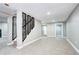 Finished basement with modern railings, neutral carpet, recessed lighting, and an open layout at 507 S Pontiac Way, Denver, CO 80224