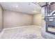 Unfinished basement area with concrete flooring and utility equipment at 507 S Pontiac Way, Denver, CO 80224