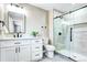 Elegant bathroom with marble countertops, sleek black fixtures, and glass-enclosed shower at 507 S Pontiac Way, Denver, CO 80224