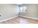 Cozy bedroom features hardwood floors, a window, and neutral paint, creating a serene space at 507 S Pontiac Way, Denver, CO 80224