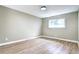 Bright bedroom showcasing hardwood floors, a window providing natural light, and neutral wall color at 507 S Pontiac Way, Denver, CO 80224