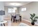 The dining room shows wood floors and a modern light fixture for a bright and inviting space at 507 S Pontiac Way, Denver, CO 80224