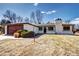 Charming single-story home boasts a brick facade, mature landscaping, and a detached two-car garage at 507 S Pontiac Way, Denver, CO 80224