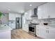 Modern kitchen featuring stainless steel appliances, updated fixtures and ample counter space at 507 S Pontiac Way, Denver, CO 80224
