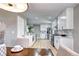 Well-lit kitchen with stainless steel appliances, white cabinetry, and sleek countertops at 507 S Pontiac Way, Denver, CO 80224