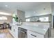 Bright kitchen with breakfast bar, stainless steel appliances and stylish countertops at 507 S Pontiac Way, Denver, CO 80224