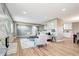 The inviting living room features wood floors, a modern fireplace, and is open to the kitchen and dining areas at 507 S Pontiac Way, Denver, CO 80224