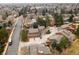 High-angle view showcasing the residential area, including homes, roads, and green spaces in the distance at 1276 Harrison Ct, Boulder, CO 80303