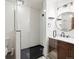 Bathroom featuring a walk in shower, white subway tiles, and a modern vanity at 1276 Harrison Ct, Boulder, CO 80303