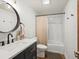 Bathroom featuring a tub shower, white subway tile, and a modern vanity at 1276 Harrison Ct, Boulder, CO 80303