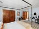 Bedroom featuring a four poster bed, adjacent walk-in closet, and decor at 1276 Harrison Ct, Boulder, CO 80303