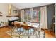 Stylish dining room with fireplace, hardwood floors, lots of natural light, and modern decor at 1276 Harrison Ct, Boulder, CO 80303
