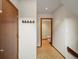 Hallway leads to a half-bathroom with wood flooring and a neutral color scheme at 1276 Harrison Ct, Boulder, CO 80303