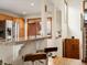 Kitchen with granite countertops and breakfast bar, stainless steel appliances, and wood cabinets at 1276 Harrison Ct, Boulder, CO 80303
