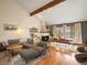 Bright and airy living room with a cozy fireplace, hardwood floors, and modern furnishings at 1276 Harrison Ct, Boulder, CO 80303