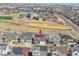 A charming home is shown in an aerial view, complete with solar panels on the roof at 18101 E 44Th Pl, Denver, CO 80249