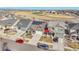 Aerial shot of house in suburban neighborhood with solar panels and a red arrow at 18101 E 44Th Pl, Denver, CO 80249
