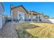 A spacious backyard with a covered patio, perfect for outdoor living at 18101 E 44Th Pl, Denver, CO 80249