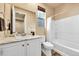 Clean bathroom with tub, shower, granite counters and white cabinets at 18101 E 44Th Pl, Denver, CO 80249