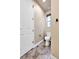 Well-lit half bathroom featuring a modern toilet and neutral walls at 18101 E 44Th Pl, Denver, CO 80249