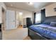 Comfortable bedroom featuring an attached bathroom and natural light at 18101 E 44Th Pl, Denver, CO 80249