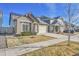 Charming home with a well-maintained lawn, solar panels, and a two-car garage at 18101 E 44Th Pl, Denver, CO 80249