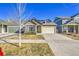 Inviting exterior view with tidy front yard and two-car garage at 18101 E 44Th Pl, Denver, CO 80249