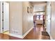 Inviting hallway with hardwood floors leading to a bright living space at 18101 E 44Th Pl, Denver, CO 80249
