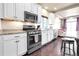 Modern kitchen features granite countertops, stainless steel appliances, and ample cabinet space at 18101 E 44Th Pl, Denver, CO 80249