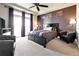 Cozy main bedroom featuring plush carpet, and a ceiling fan at 18101 E 44Th Pl, Denver, CO 80249