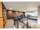 Bright recreation room featuring a home office, staircase, and carpeting at 18101 E 44Th Pl, Denver, CO 80249