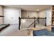 Bright rec room featuring a large storage closet and staircase at 18101 E 44Th Pl, Denver, CO 80249