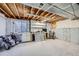 Spacious unfinished basement with exposed beams, a window, and potential for customization at 398 Benton St, Castle Rock, CO 80104