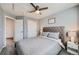Comfortable bedroom featuring a ceiling fan, plush carpet, and a soft, tufted headboard at 398 Benton St, Castle Rock, CO 80104