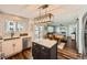 Open-concept kitchen featuring a center island, stainless steel appliances, and a view of the living room at 398 Benton St, Castle Rock, CO 80104